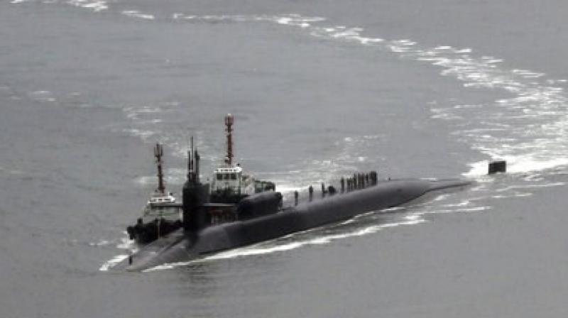 The nuclear-powered submarine USS Michigan approaches to join the US aircraft carrier USS Carl Vinson in drills near the Korean Peninsula. (Photo: AP) The nuclear-powered submarine USS Michigan approaches to join the US aircraft carrier USS Carl Vinson in drills near the Korean Peninsula. (Photo: AP)