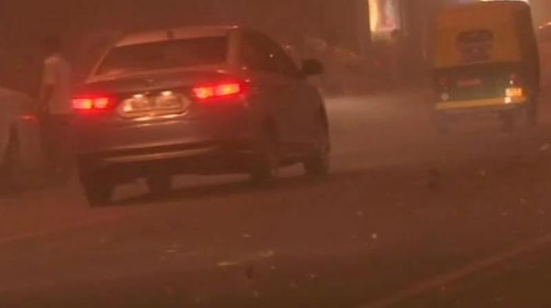 Dust storm brought the maximum temperature down from 42 degrees Celsius at 8:30 pm to 35 degree Celsius at 9 pm. (Photo: ANI | Twitter) Dust storm brought the maximum temperature down from 42 degrees Celsius at 8:30 pm to 35 degree Celsius at 9 pm. (Photo: ANI | Twitter)