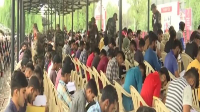 Kashmiri youth taking army recruitment test in Budgam. (Photo: ANI) Kashmiri youth taking army recruitment test in Budgam. (Photo: ANI)