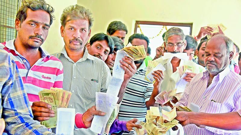 People in queue shows their electricity bills with Rs 500 and Rs 1,000 old notes at Jubilee Hills on Friday. (Photo: Deccan Chronicle) People in queue shows their electricity bills with Rs 500 and Rs 1,000 old notes at Jubilee Hills on Friday. (Photo: Deccan Chronicle)