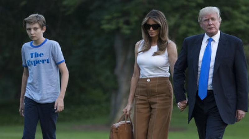 President Donald Trump, first lady Melania Trump, and their son and Barron Trump walk from Marine One across the South Lawn to the White House in Washington. (Photo: AP) President Donald Trump, first lady Melania Trump, and their son and Barron Trump walk from Marine One across the South Lawn to the White House in Washington. (Photo: AP)