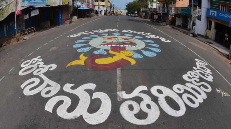 Residents of Visalakshinagar in Visakhapatham in Andhra Pradesh commissioned a street painting to spread the message of precautions to curb the spread of COVID-19. (DC Photo: K Muralikrishna)