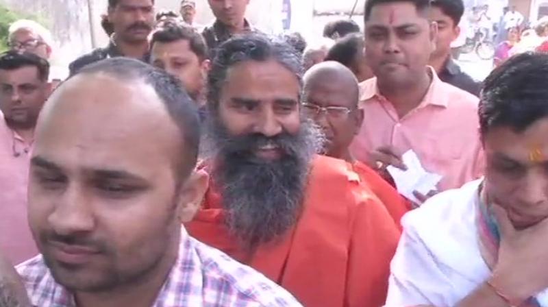 Ramdev was joined by his close associates Acharya Balkrishna and Swami Muktananda Maharaj at the polling booth. (Photo: ANI) Ramdev was joined by his close associates Acharya Balkrishna and Swami Muktananda Maharaj at the polling booth. (Photo: ANI)