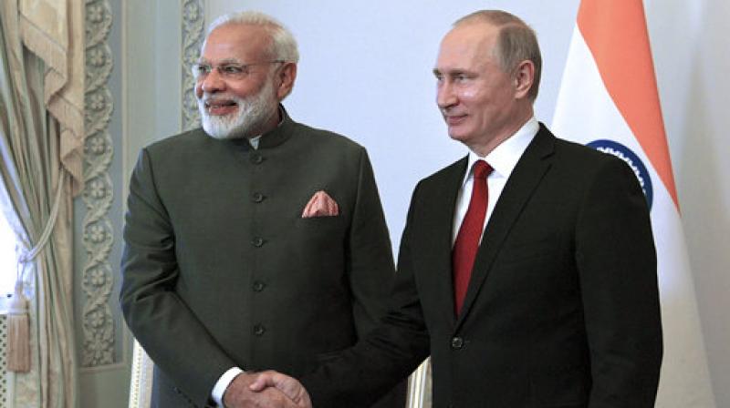 Russian President Vladimir Putin, right, shakes hands with India's Prime Minister Narendra Modi prior their talks at the St. Petersburg International Economic Forum in St. Petersburg, Russia. (Photo: AP) Russian President Vladimir Putin, right, shakes hands with India's Prime Minister Narendra Modi prior their talks at the St. Petersburg International Economic Forum in St. Petersburg, Russia. (Photo: AP)