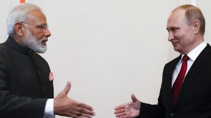 Russian President Vladimir Putin, right, shakes hands with Prime Minister Narendra Modi prior their talks at the St. Petersburg International Economic Forum in St. Petersburg, Russia. (Photo: AP) Russian President Vladimir Putin, right, shakes hands with Prime Minister Narendra Modi prior their talks at the St. Petersburg International Economic Forum in St. Petersburg, Russia. (Photo: AP)