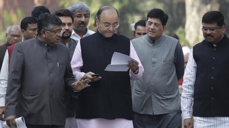 Finance Minister Arun Jaitley walking towards the Parliament. (Photo: PTI/File) Finance Minister Arun Jaitley walking towards the Parliament. (Photo: PTI/File)