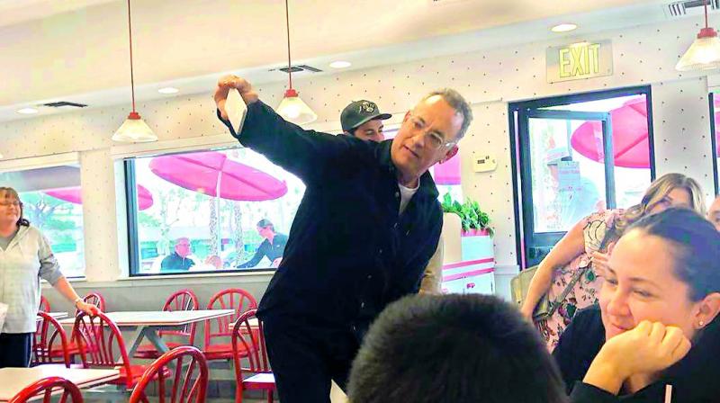 The actor also grabbed a burger for himself with his wife, actress Rita Wilson. The actor also grabbed a burger for himself with his wife, actress Rita Wilson.