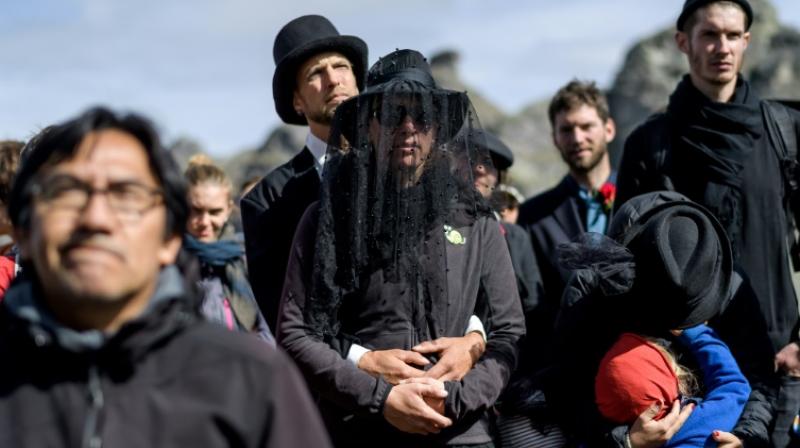 People held a funeral on the mountainside to bid adieu to Pizol glacier. (Photo: AFP) People held a funeral on the mountainside to bid adieu to Pizol glacier. (Photo: AFP)