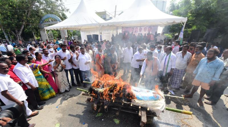 YSRC cadre raised anti-Naidu slogans and demanded that he apologise for the derogatory remarks made by his partys national spokesperson K. Pattabhi Ram.    DC Image