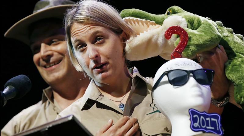 Matthew Rockloff, left, and Nancy Greer give their acceptance speech after winning the Ig Nobel Economics Prize during ceremonies at Harvard University in Cambridge. (Photo: AP) Matthew Rockloff, left, and Nancy Greer give their acceptance speech after winning the Ig Nobel Economics Prize during ceremonies at Harvard University in Cambridge. (Photo: AP)