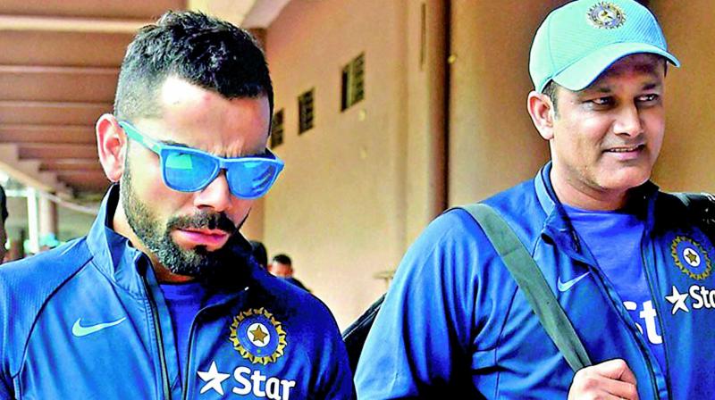 Virat Kohli and Anil Kumble. Virat Kohli and Anil Kumble.