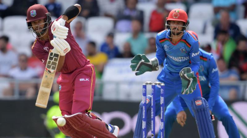 Opener Evin Lewis celebrated his return to the team with 58 and Nicholas Pooran also made 58, his third 50-plus score of the tournament. (Photo: AFP) Opener Evin Lewis celebrated his return to the team with 58 and Nicholas Pooran also made 58, his third 50-plus score of the tournament. (Photo: AFP)