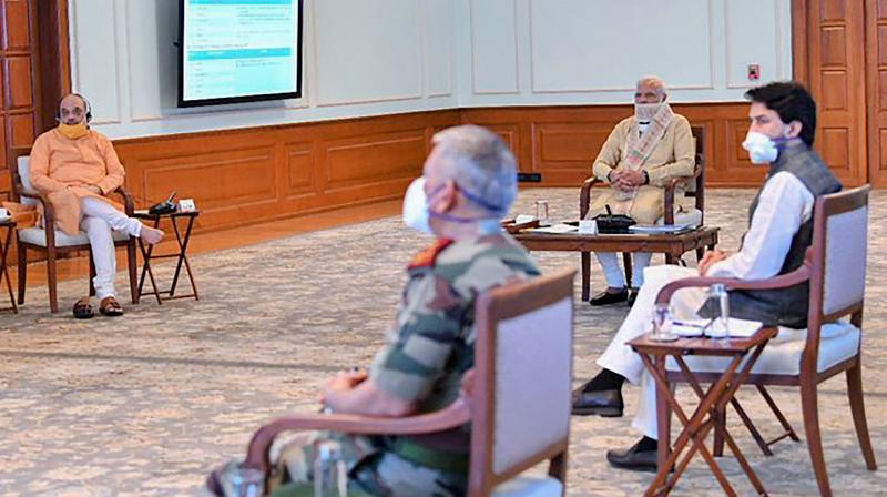 Prime Minister Narendra Modi holds a review meeting to discuss civil aviation sector, in New Delhi, Friday, May 1, 2020. Home Minister Amit Shah is also seen. PTI Photo