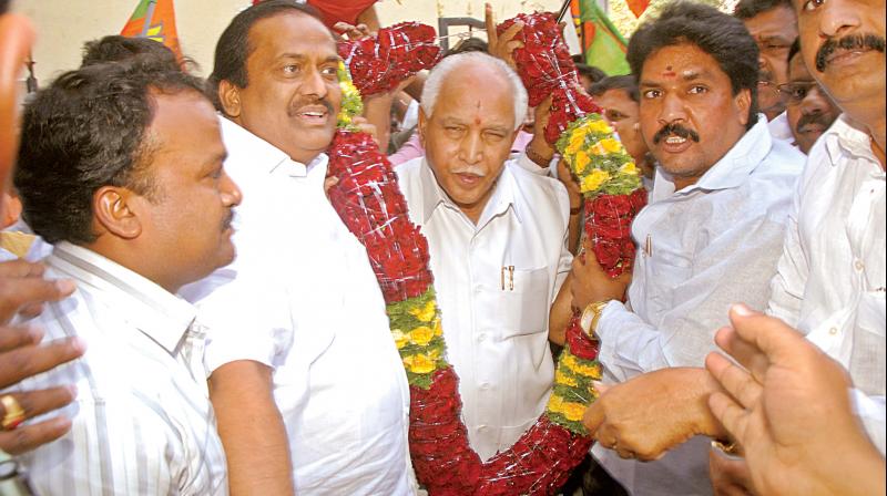 Former chief minister and BJP state president B.S. Yeddyurappa being greeted by his supporters at the BJP office in Bengaluru after the CBI court gave him a clean chit. Former chief minister and BJP state president B.S. Yeddyurappa being greeted by his supporters at the BJP office in Bengaluru after the CBI court gave him a clean chit.