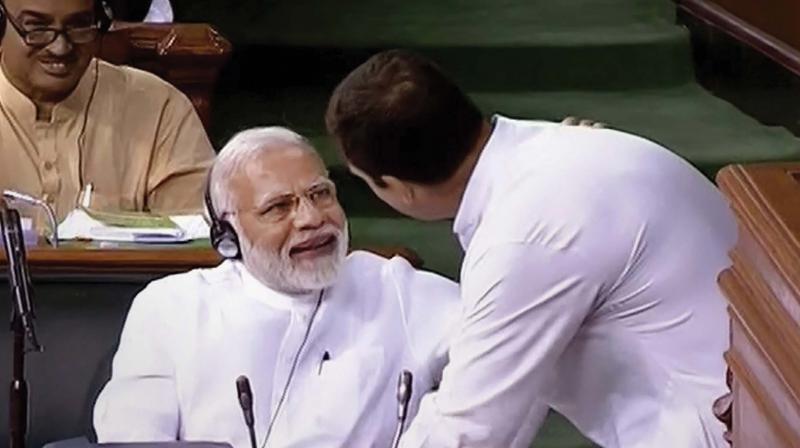 Congress president Rahul Gandhi with Prime Minister Narendra Modi after his speech in the Lok Sabha on the no-confidence motion during the Monsoon Session of Parliament. (Photo: PTI) Congress president Rahul Gandhi with Prime Minister Narendra Modi after his speech in the Lok Sabha on the no-confidence motion during the Monsoon Session of Parliament. (Photo: PTI)