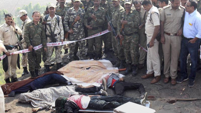 Police at the encounter site at the hillocks of Acharpura village after the STF killed 8 Students of Islamic Movement of India (SIMI) activists who escaped Central Jail killing a security guard in Bhopal. (Photo: PTI) Police at the encounter site at the hillocks of Acharpura village after the STF killed 8 Students of Islamic Movement of India (SIMI) activists who escaped Central Jail killing a security guard in Bhopal. (Photo: PTI)