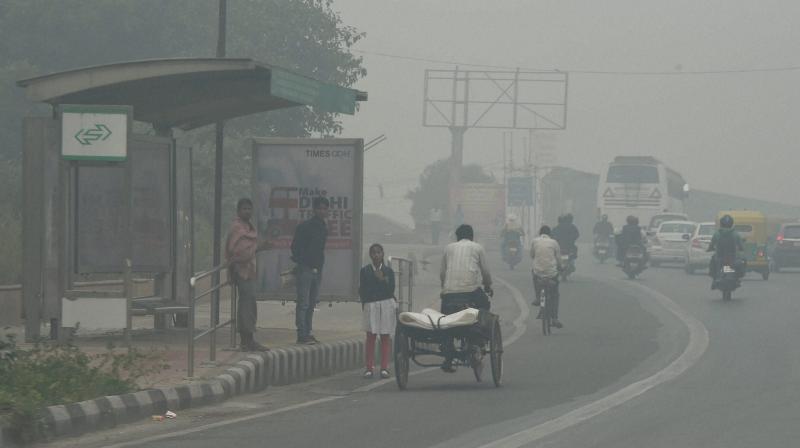 A view of a Delhi street covered with dense smog. (Photo: PTI) A view of a Delhi street covered with dense smog. (Photo: PTI)