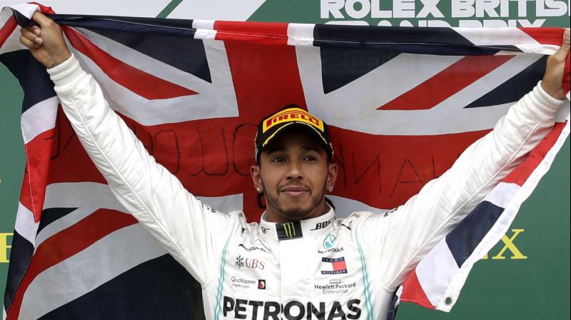 Hamilton, who stopped on his slow-down lap to collect a British 'Union Jack' flag, added: "I love you Silverstone. I appreciate everything and the opportunity to be a part of this. (Photo: AP) Hamilton, who stopped on his slow-down lap to collect a British 'Union Jack' flag, added: "I love you Silverstone. I appreciate everything and the opportunity to be a part of this. (Photo: AP)
