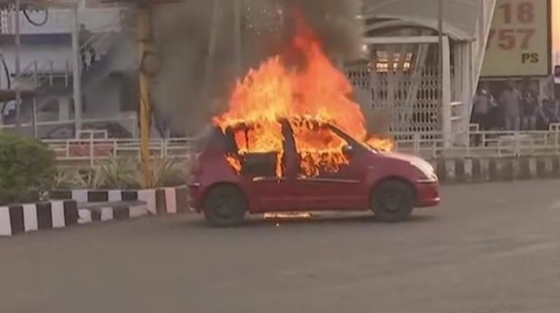 Karni Sena members accidentally torched their own member’s vehicle while protesting in Bhopal. (Twitter Screengrab/ ANI) Karni Sena members accidentally torched their own member’s vehicle while protesting in Bhopal. (Twitter Screengrab/ ANI)