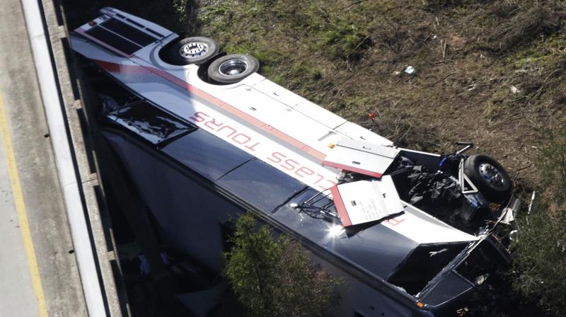 The cause of the crash wasn’t immediately known, but survivors from Channelview High School in metro Houston described being asleep one moment and tumbling through the air the next. (Photo: AP) The cause of the crash wasn’t immediately known, but survivors from Channelview High School in metro Houston described being asleep one moment and tumbling through the air the next. (Photo: AP)