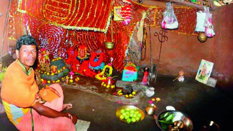 A priest performs puja praying for recovery of Japanese Encephalitis-affected children in Malkangiri district of Odisha. (Photo: DC) A priest performs puja praying for recovery of Japanese Encephalitis-affected children in Malkangiri district of Odisha. (Photo: DC)