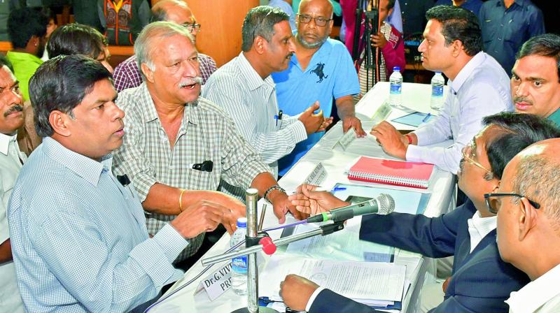 Members argue with the chair at the Hyderabad Cricket Association’s Special General Meeting at the Rajiv Gandhi International Cricket Stadium on Sunday. Members argue with the chair at the Hyderabad Cricket Association’s Special General Meeting at the Rajiv Gandhi International Cricket Stadium on Sunday.