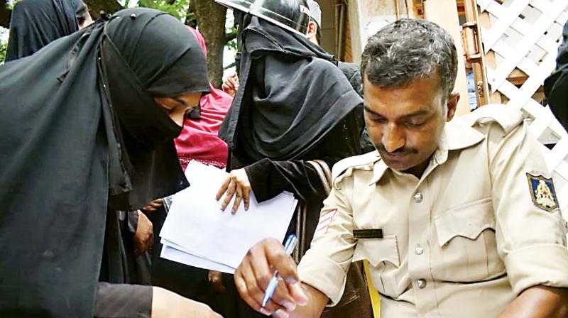 A victim filing a complaint with the police at the IMA office in Shivajinagar on Tuesday (Photo: DC) A victim filing a complaint with the police at the IMA office in Shivajinagar on Tuesday (Photo: DC)