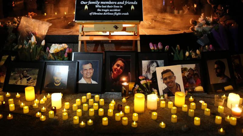 An altar with photographs of the victims who were killed in a plane crash in Iran is seen as people gather around to held a vigil in their memories. AFP photo An altar with photographs of the victims who were killed in a plane crash in Iran is seen as people gather around to held a vigil in their memories. AFP photo