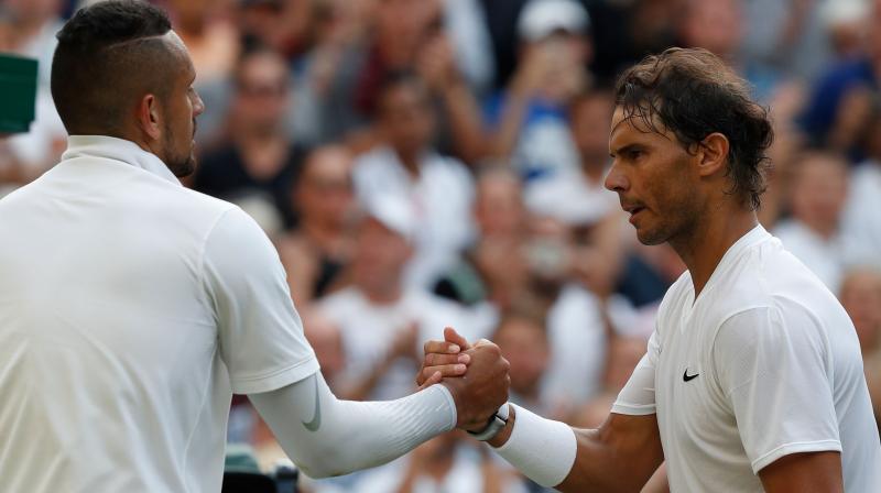 Nadal triumphed 6-3, 3-6, 7-6, 7-6 in a second-round Centre Court duel which saw the combustible Australian pick up a code violation for unsportsmanlike behaviour. (Photo: AFP) Nadal triumphed 6-3, 3-6, 7-6, 7-6 in a second-round Centre Court duel which saw the combustible Australian pick up a code violation for unsportsmanlike behaviour. (Photo: AFP)
