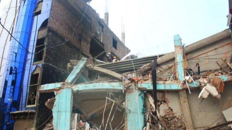 The building collapsed during the wee hours of Tuesday. (Photo: ANI/Twitter) The building collapsed during the wee hours of Tuesday. (Photo: ANI/Twitter)
