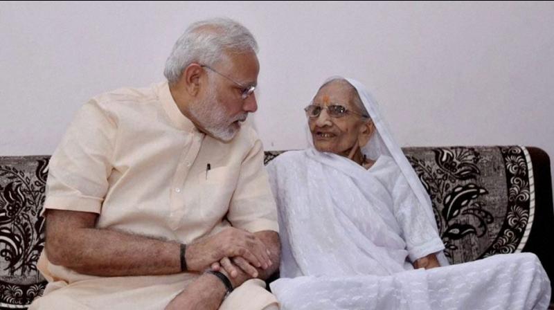 Prime Minister Narendra Modi with his mother. (Photo: PTI) Prime Minister Narendra Modi with his mother. (Photo: PTI)