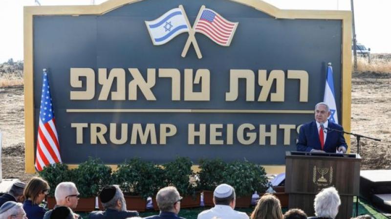 Netanyahu unveiled a 'Trump Heights' sign, featuring an Israeli and a US flag, to mark the site of the new settlement. (Photo: AFP) Netanyahu unveiled a 'Trump Heights' sign, featuring an Israeli and a US flag, to mark the site of the new settlement. (Photo: AFP)