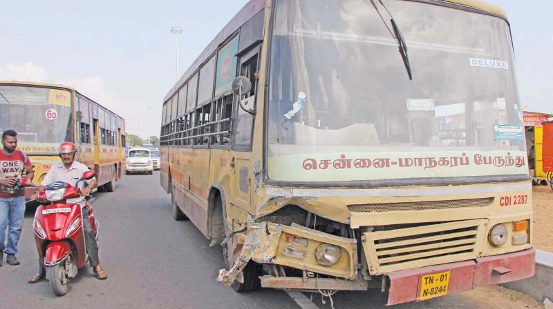 The MTC bus and the call taxi (top) that collided head-on on Kamaraj Salai on Friday. (Photo: DC) The MTC bus and the call taxi (top) that collided head-on on Kamaraj Salai on Friday. (Photo: DC)
