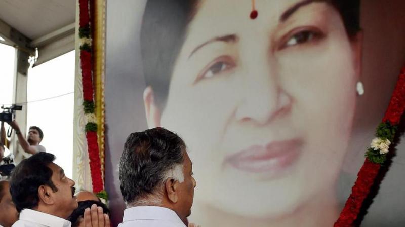 Tamil Nadu Chief Minister K Palanisamy and his deptuy, O Panneerselvam, pay tributes at the memorial of J Jayalalithaa following a merger of their factions in Chennai on Monday. (Photo: PTI) Tamil Nadu Chief Minister K Palanisamy and his deptuy, O Panneerselvam, pay tributes at the memorial of J Jayalalithaa following a merger of their factions in Chennai on Monday. (Photo: PTI)