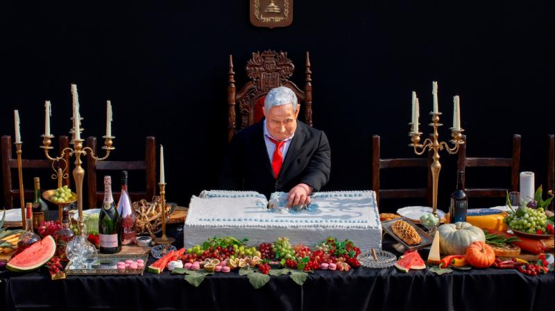 An installation depicting Prime Minister Benjamin Netanyahu at a mock \Last Supper\ by Israeli artist Itay Zalait, is placed at Rabin square in Tel Aviv, Israel. (AP)