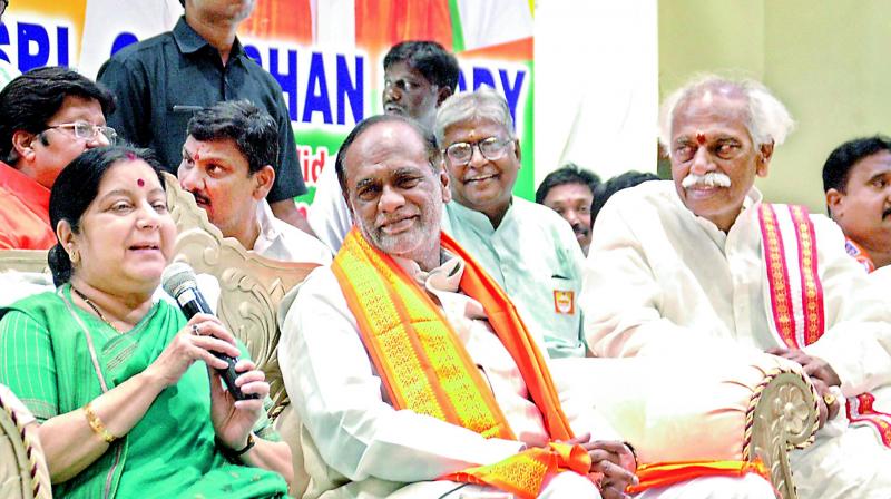 Sushma Swaraj addressed the crowd during her one of her visits to the city. Ex-MP Bandaru Dattatreya (R) and BJP state president K. Laxman had accompanied her. (Photo: DC) Sushma Swaraj addressed the crowd during her one of her visits to the city. Ex-MP Bandaru Dattatreya (R) and BJP state president K. Laxman had accompanied her. (Photo: DC)