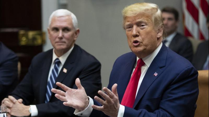 President Donald Trump with Vice President Mike Pence, speaks during a coronavirus briefing with Airline CEOs in the Roosevelt Room of the White House. AP Photo