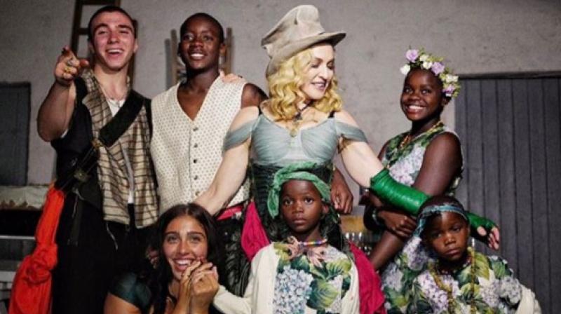 Madonna with her children. Madonna with her children.