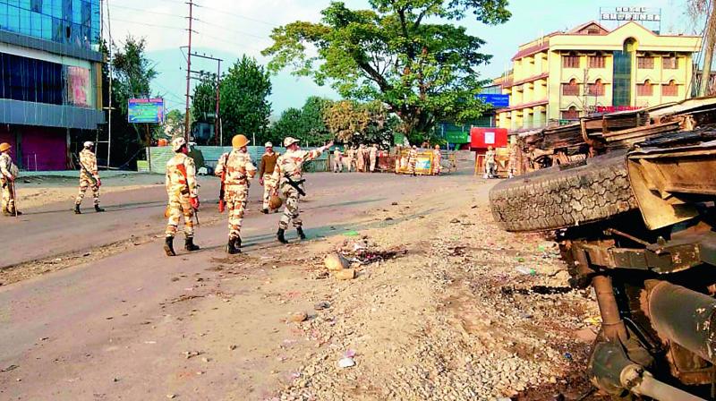 Security personnel patrol a street during a protest in Itanagar, Sunday (Photo: AP) Security personnel patrol a street during a protest in Itanagar, Sunday (Photo: AP)