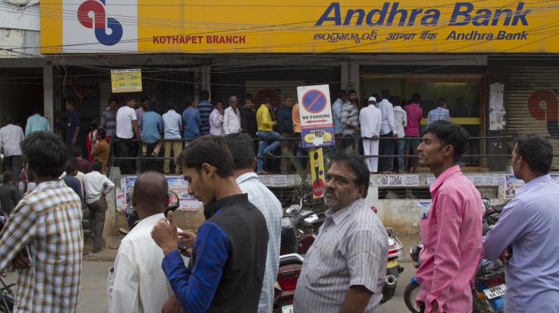 People stand in a queue outside an ATM to withdraw money in Hyderabad. (Photo: AP) People stand in a queue outside an ATM to withdraw money in Hyderabad. (Photo: AP)