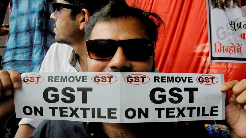 In past, textile owners had demanded government to scrap GST on textiles. (Photo: Representational/PTI) In past, textile owners had demanded government to scrap GST on textiles. (Photo: Representational/PTI)