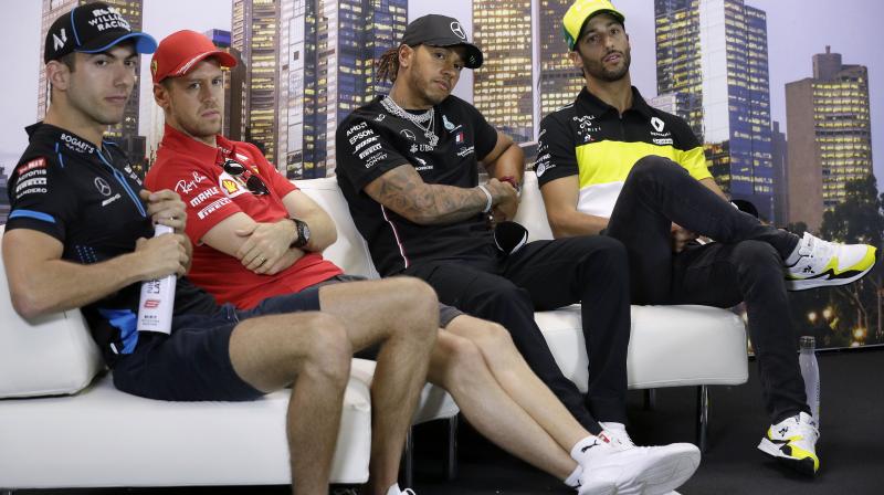 Formula One drivers (from left) Williams Nicholas Latifi of Canada, Ferraris Sebastian Vettel of Germany, Mercedes Lewis Hamilton of Britain and Renaults Daniel Ricciardo of Australia attend pre-race a press conference at the Australian Formula One Grand Prix in Melbourne on Thursday. AP Photo