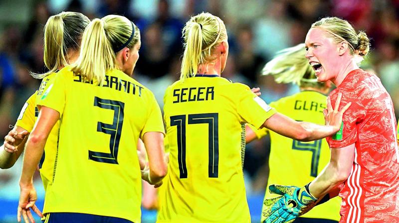 Sweden’s goalkeeper Hedvig Lindahl (right) is congratulated by teammates after saving a penalty against Canada during the Women’s World Cup pre-quarterfinal football match at the Parc des Princes stadium in Paris on Tuesday. (Photo: AFP) Sweden’s goalkeeper Hedvig Lindahl (right) is congratulated by teammates after saving a penalty against Canada during the Women’s World Cup pre-quarterfinal football match at the Parc des Princes stadium in Paris on Tuesday. (Photo: AFP)