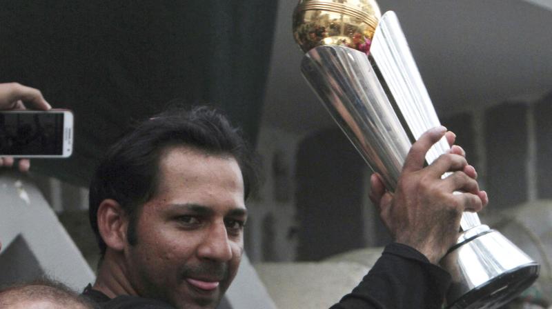 Sarfraz Ahmed held up the trophy to loud cheers and chants of "Long live Sarfraz!" as a police band played patriotic songs nearby.(Photo: AP) Sarfraz Ahmed held up the trophy to loud cheers and chants of "Long live Sarfraz!" as a police band played patriotic songs nearby.(Photo: AP)