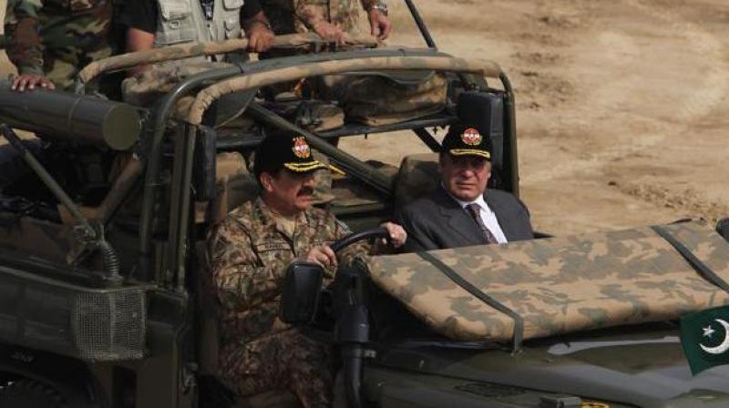 Pakistan army chief Gen Raheel Sharif with Prime Minister Nawaz Sharif during a military exercise at Khairpur Tamiwali. (Photo: AP) Pakistan army chief Gen Raheel Sharif with Prime Minister Nawaz Sharif during a military exercise at Khairpur Tamiwali. (Photo: AP)
