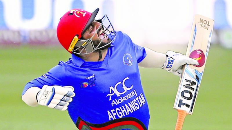 Mohammad Shahzad celebrates his century against India. (Photo: AP) Mohammad Shahzad celebrates his century against India. (Photo: AP)