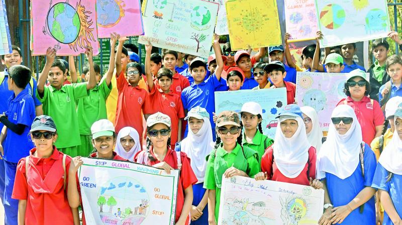 Students participate in a March at KBR park. Students participate in a March at KBR park.