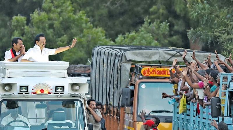 DMK president M.K. Stalin waves at women voters travelling in an open truck during his campaign at Aravakurichi. (DC) DMK president M.K. Stalin waves at women voters travelling in an open truck during his campaign at Aravakurichi. (DC)