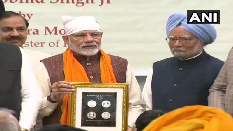 PM Modi released a commemorative coin as part of the 350th birth anniversary celebrations of 10th Sikh guru Guru Gobind Singh. (Photo: ANI) PM Modi released a commemorative coin as part of the 350th birth anniversary celebrations of 10th Sikh guru Guru Gobind Singh. (Photo: ANI)