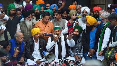 Bharatiya Kisan Union (BKU) spokesperson Rakesh Tikiat addresses media after a meeting with representatives of farmer organizations regarding the Centre's farm reform laws, near Singhu border in New Delhi, Wednesday, Dec. 9, 2020. Shiv Kumar Kakkaji is also seen. (PTI)